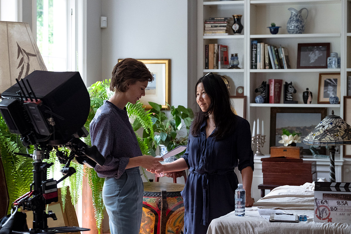 Lead actor Tilda Cobham-Hervey and director Unjoo Moon look over a script on the set of I Am Woman