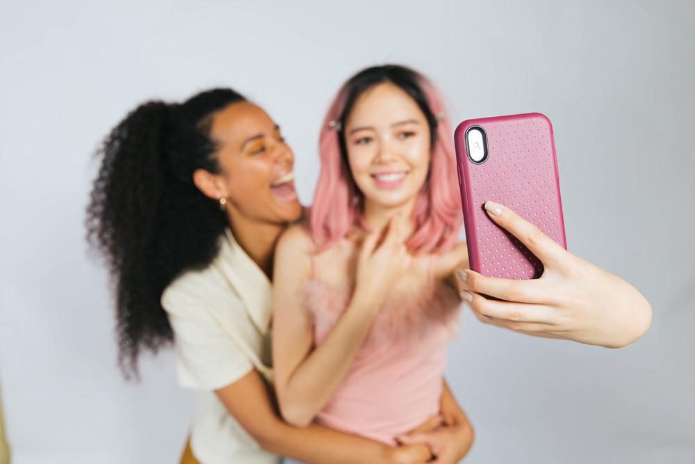 Girls smiling in front of camera, Content