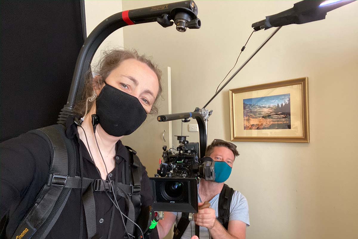 Joanne Donahoe-Beckwith and Andrew Ware with camera on the set of Fisk 