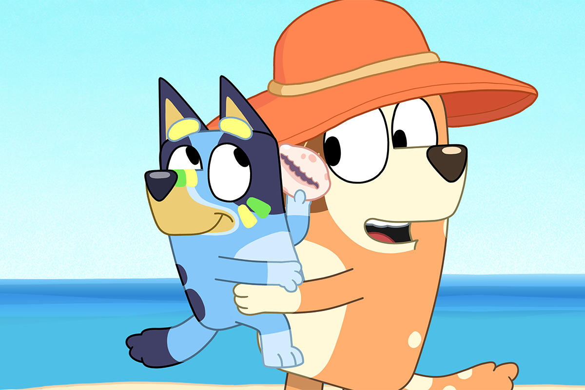 Bluey and Chilli at the beach in Bluey.
