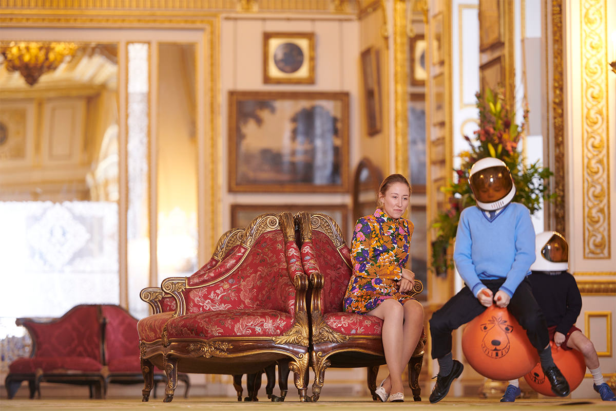 Still from The Crown, Princess Anne watches while Prince Edward and Prince Andrew play a game