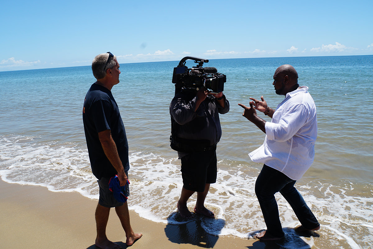 Filming on the beach for Looky Looky Here Comes Cooky