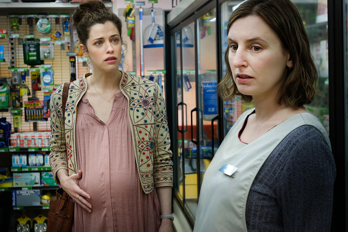 The Secret She Keeps, two pregnant women stand together in a supermarket, both look concerned
