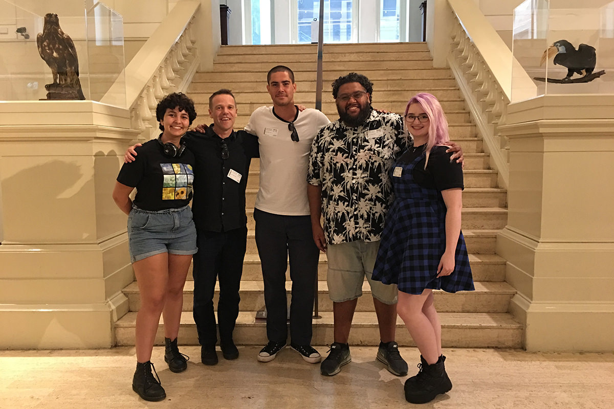 The Cooked team stand in front of the steps at the Australian Museum.