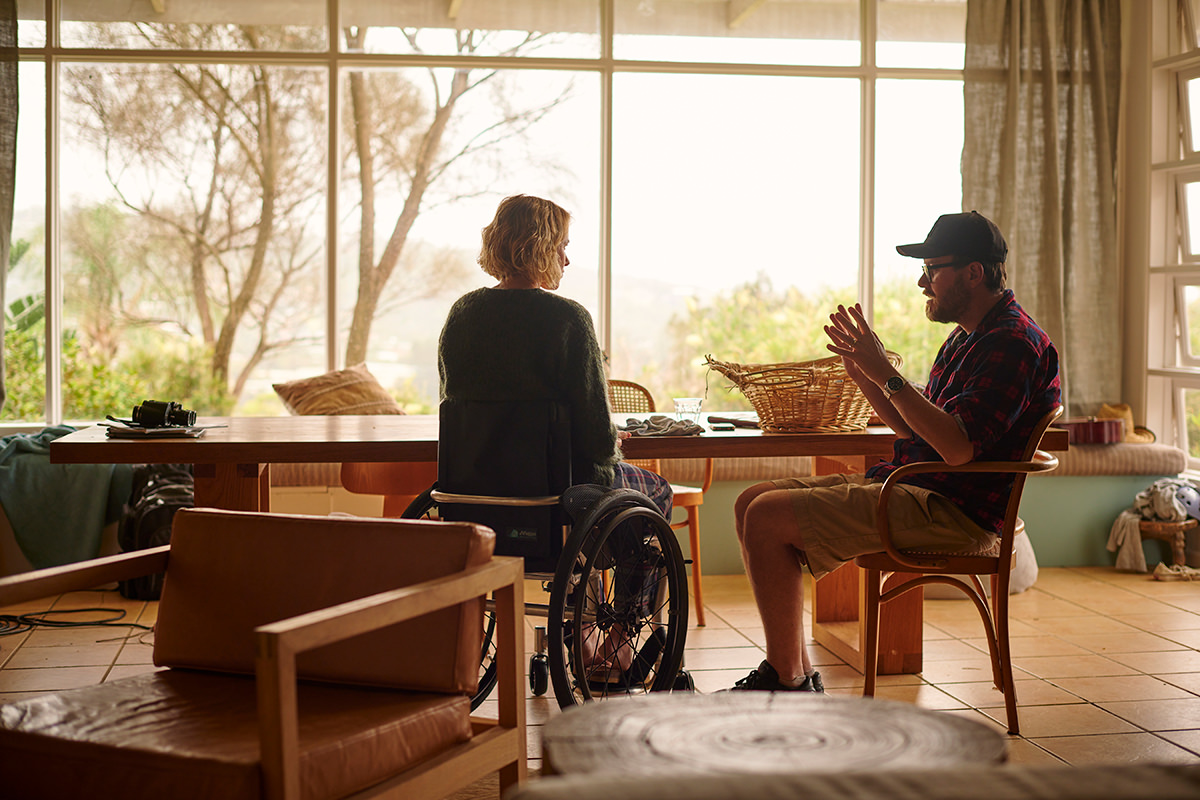 Naomi Watts and director Glendyn Ivin sit together at a table on the set of Penguin Bloom