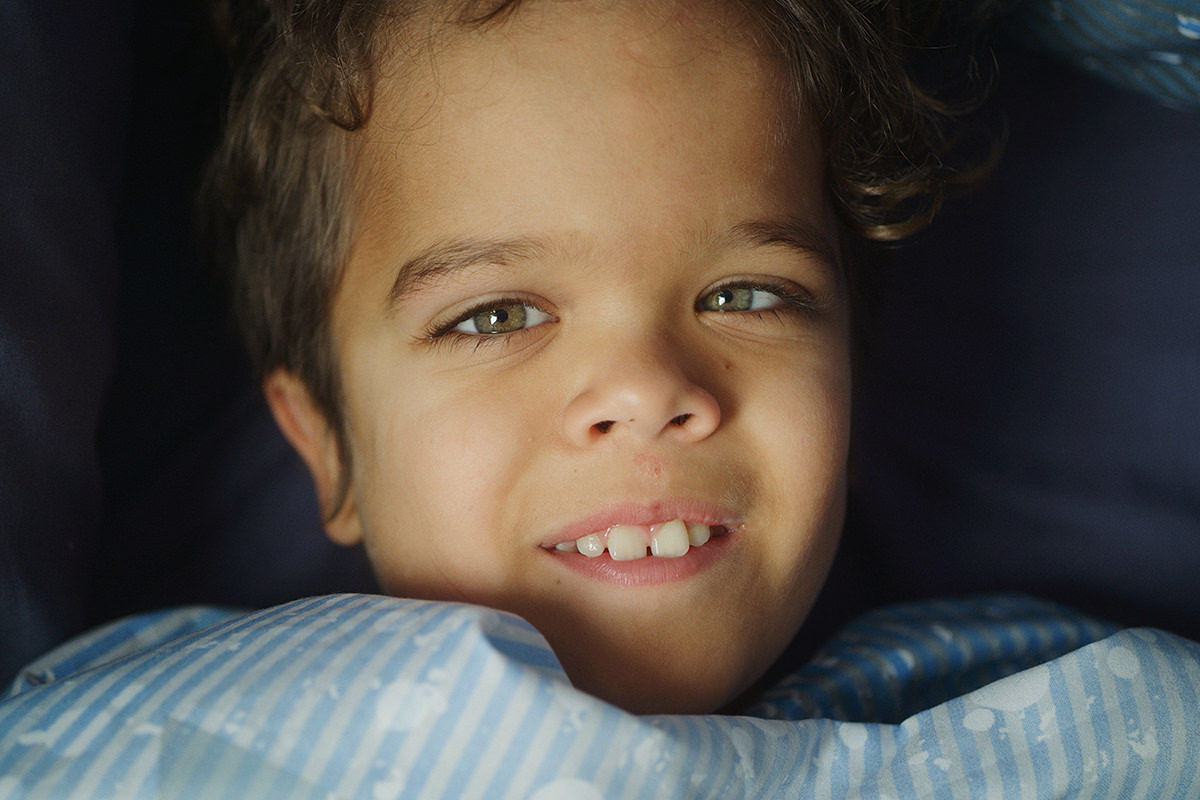 A young boy smiling