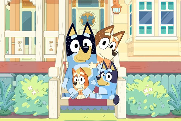 Bandit & Chilli (back), Bingo and Bluey (front) sitting on the steps of their house.